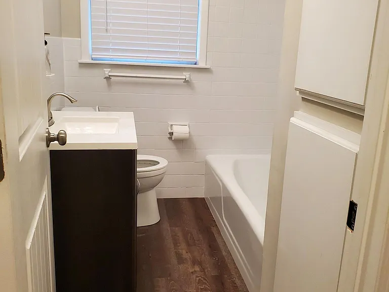 Hall Bathroom with storage cabinets