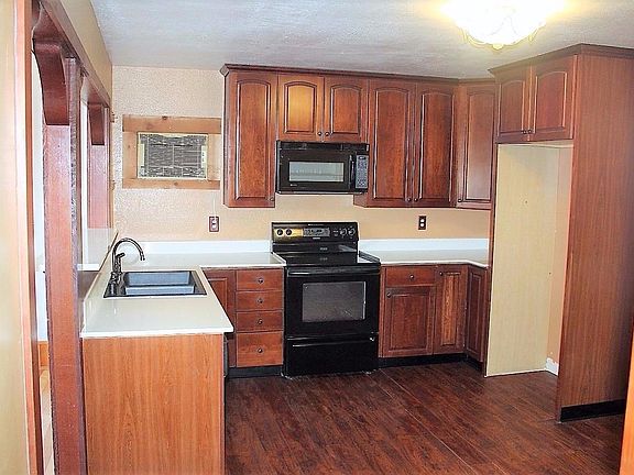 The kitchen was remodeled not long ago with "Lazy Susan" Cherry Wood Cabinets per seller and built in appliances.