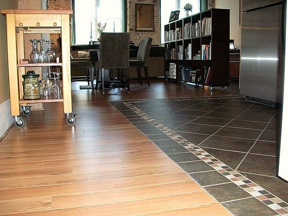 Upgraded wood floors and beautiful molding add warmth and reduce noise. Beautiful tile separates kit