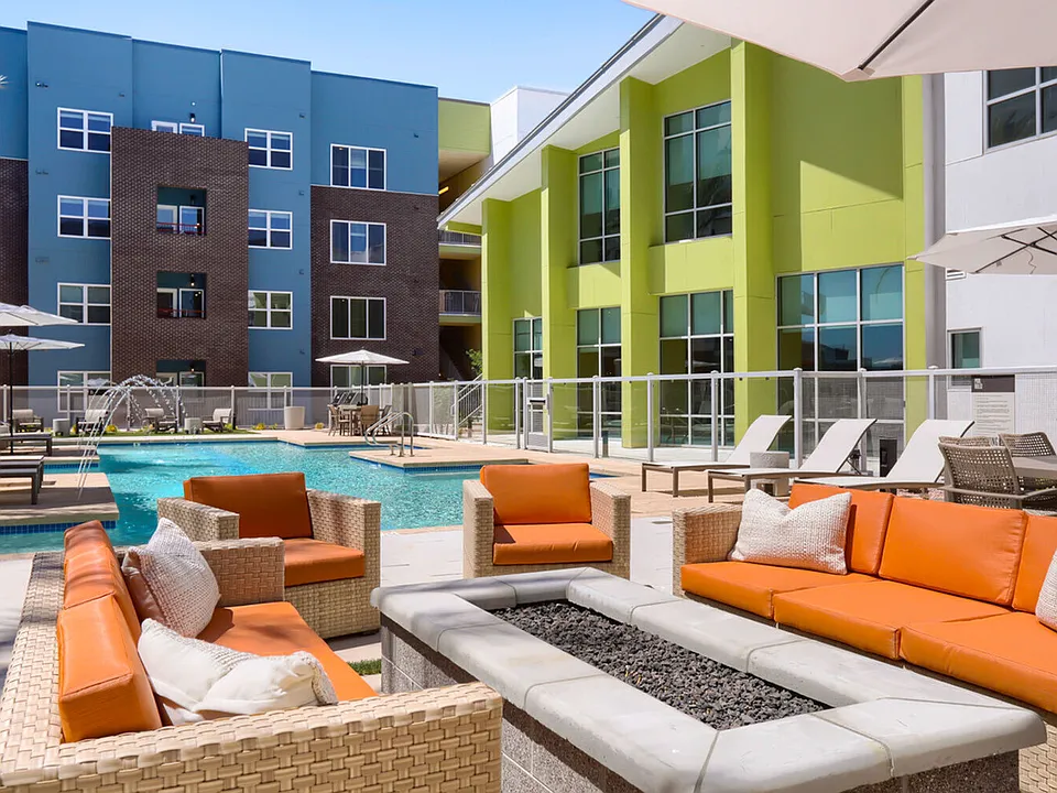 Your personal resort, every day. The Garrett Uptown pool deck features a fire pit lounge, resort-style seating, water features, and private cabanas _ the ultimate Arizona outdoor living experience.