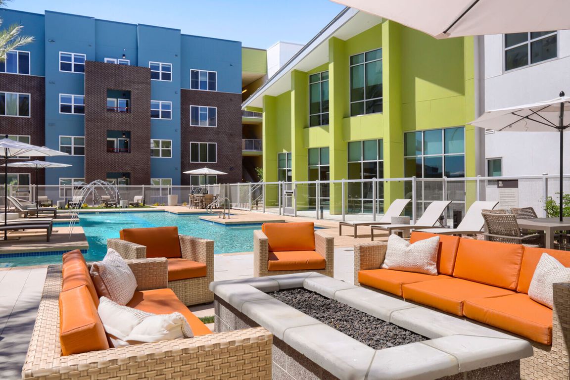 Your personal resort, every day. The Garrett Uptown pool deck features a fire pit lounge, resort-style seating, water features, and private cabanas _ the ultimate Arizona outdoor living experience.