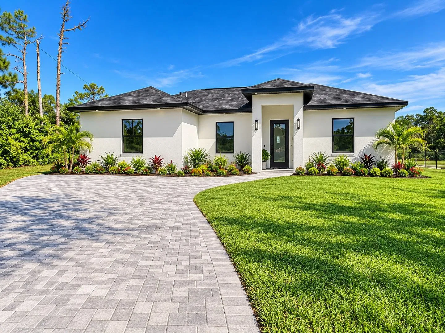 Brand-New Pool Home with a Legal Mother-in-Law Suite in Lehigh Acres FL! — Photo 1