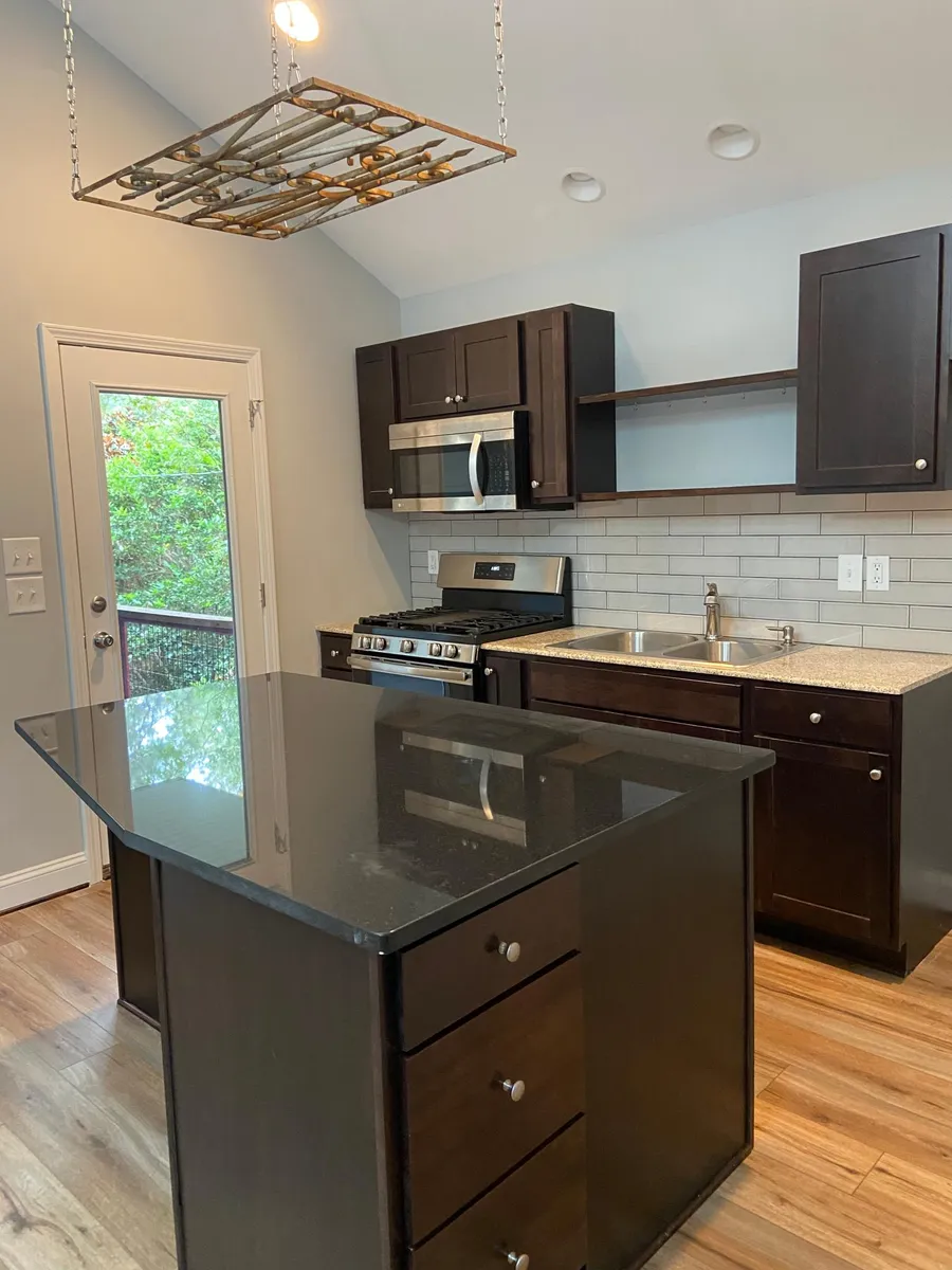 Side view of Kitchen with upstairs patio - 3118 Stedman Dr #C