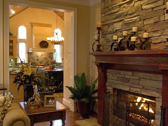 Stone fireplace with grand mantle-it has outlets