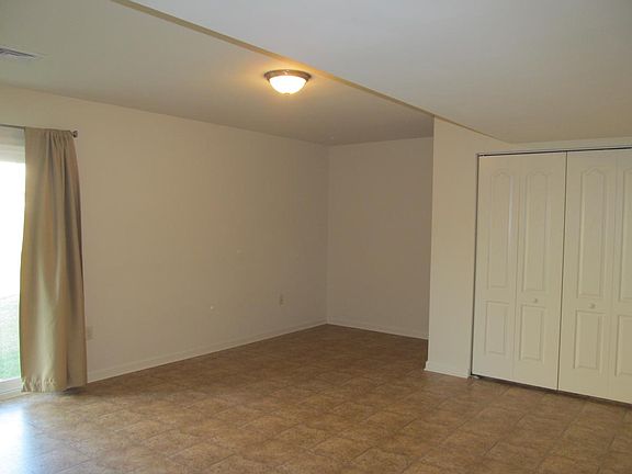 Den with walkout to backyard