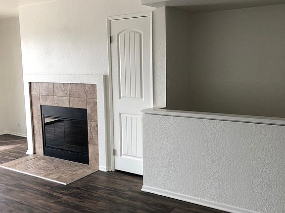 Living Room with Wood Burning Fireplace