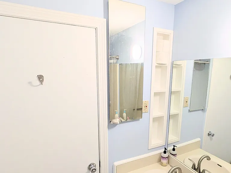 Bathroom with more storage benind the mirror