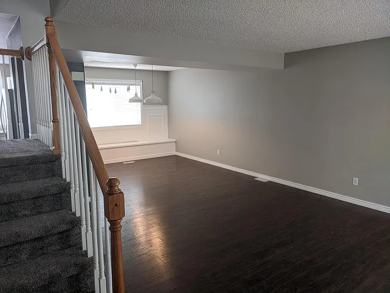 Formal dining area with window seating and built in storage