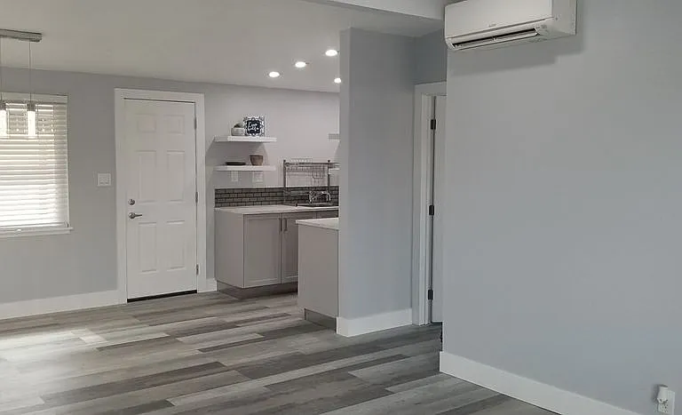 Front door looking at living room and kitchen