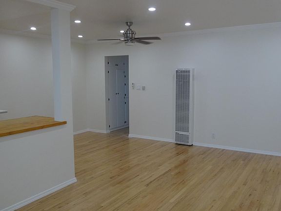 Large open concept living and dining room with recessed lighting