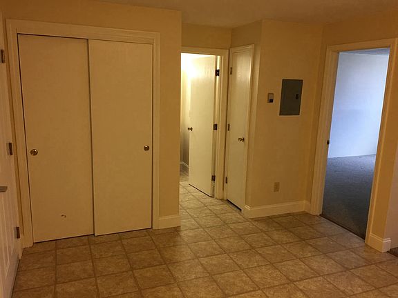 Kitchen one bedroom apartment looking toward bathroom and bedroom