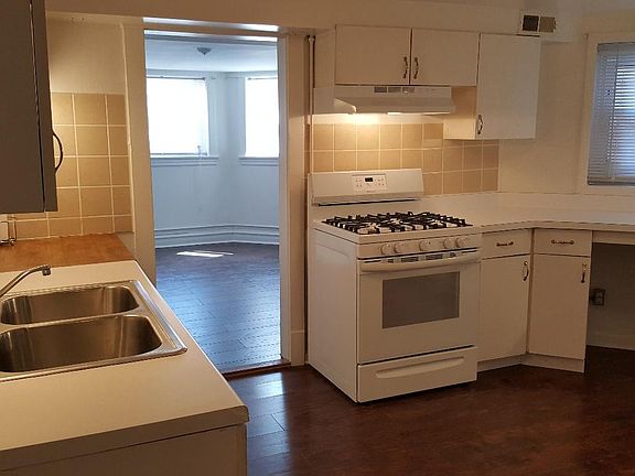 Spacious, bright kitchen with tons of cabinets and counter s