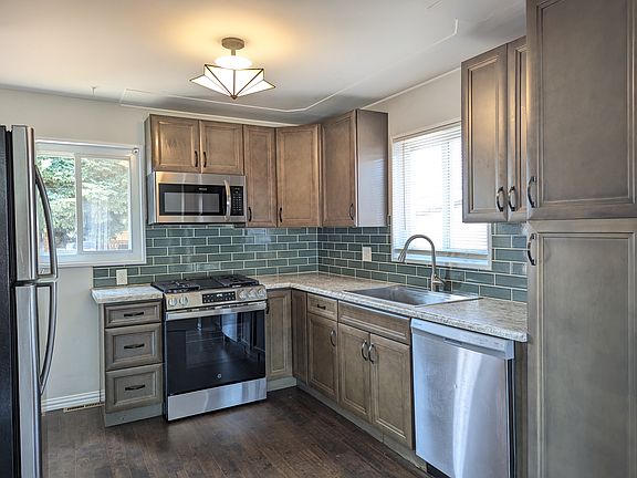 Pantry cabinet, dishwasher, microwave, gas range