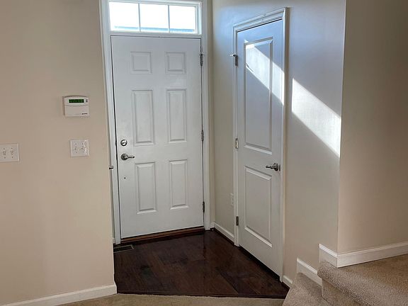 Front entrance with powder 1/2 bathroom and closet