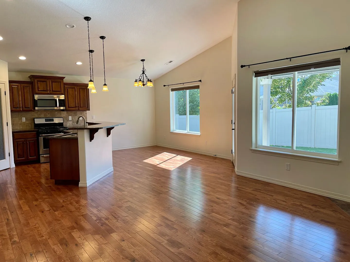 Live In Luxury with Vaulted Ceilings, Granite Countertops, and a Gas Fireplace! — Photo 3