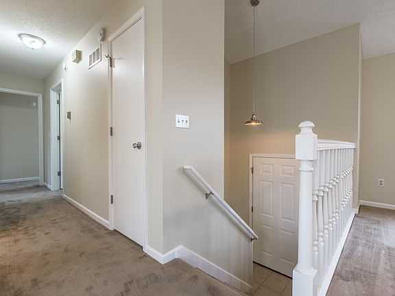 Split Entry - hallway to 3 bedrooms & coat closet.