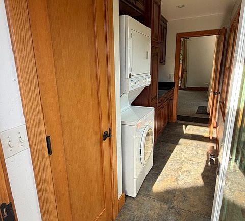 Main entry with closet, laundry, storage and sink area.