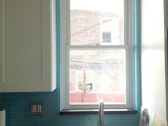 Architectural detail- backslash wrapped around window with g