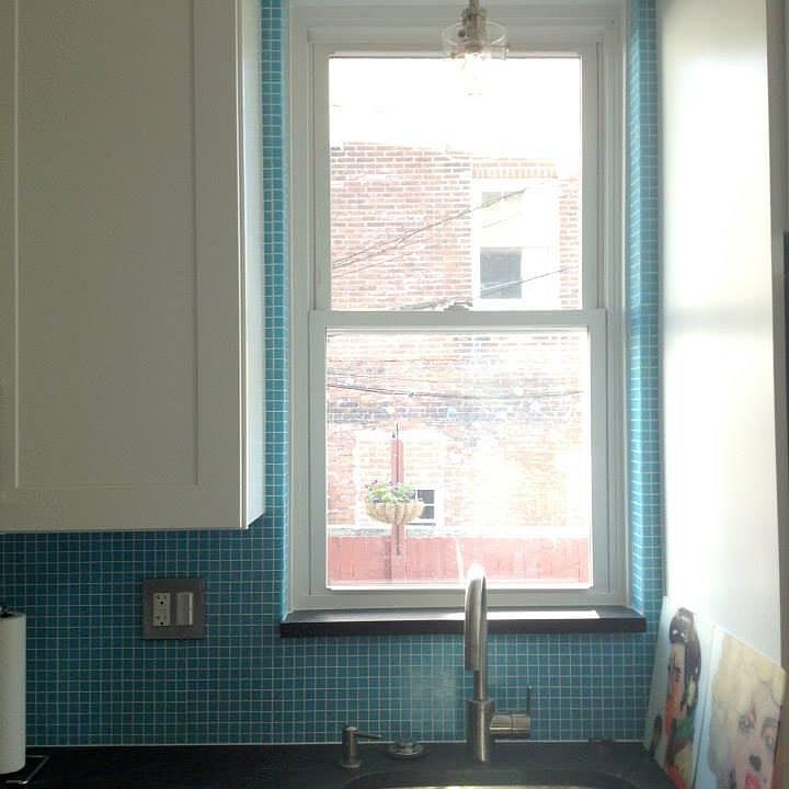 Architectural detail- backslash wrapped around window with g