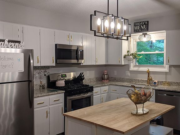 Large, open concept kitchen with all new appliances, granite and upgrades