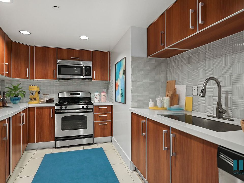 Full-Size Kitchen with Stainless-Steel Appliances and Ample Cabinet Storage