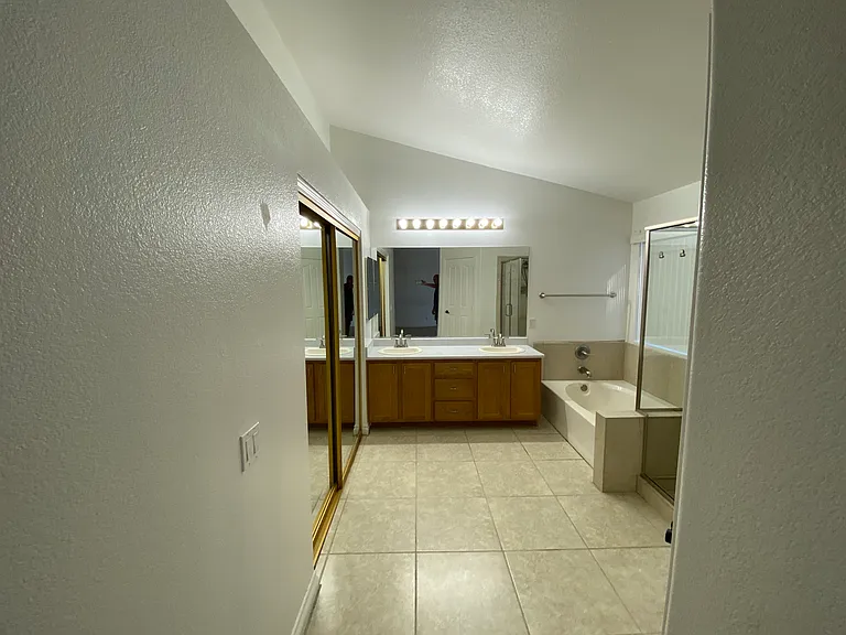 Bedroom #1 - Master entrance to master bath with double sinks, tub, wak-in shower, and closet.