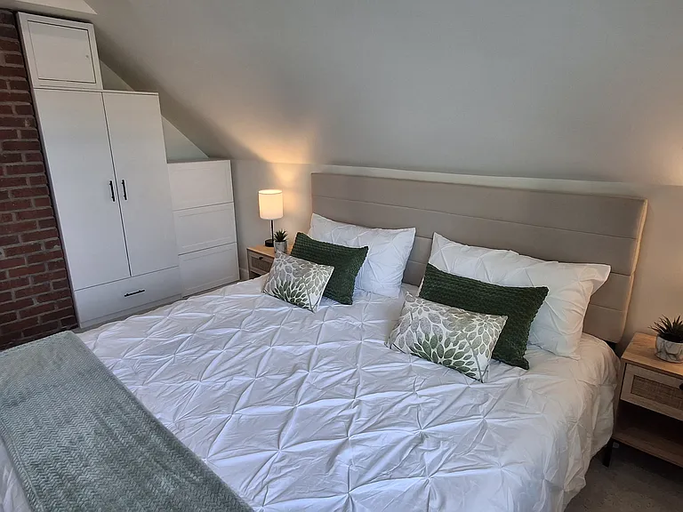 Tall closet and built-in dressers provide ample space