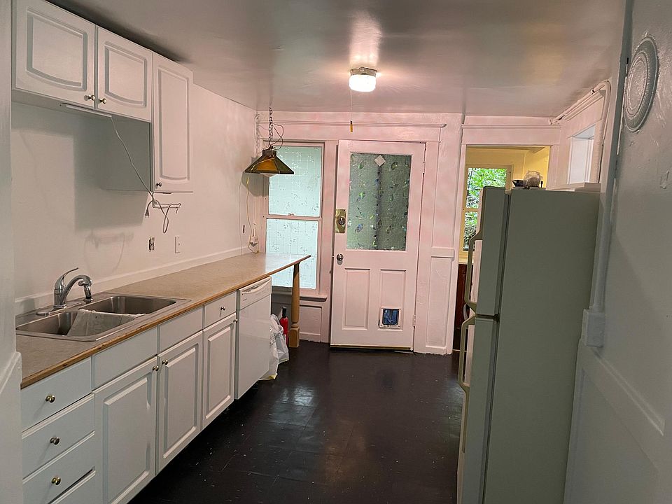 Kitchen w/ walk-in pantry and backdoor access to shared yard