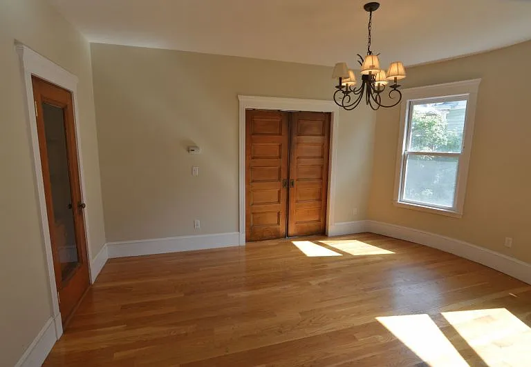 Dining room with inset pantry off to left and pocket doors