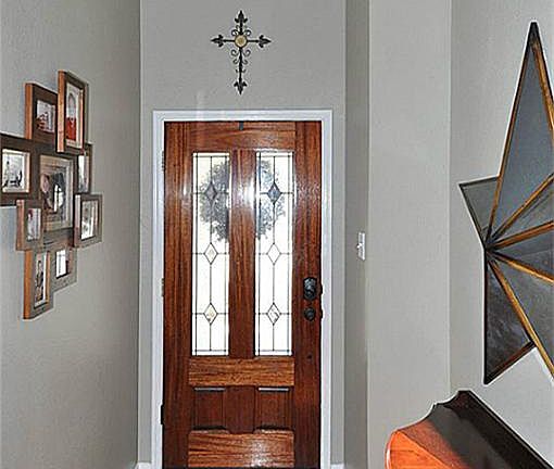 Solid Mahogany wood & glass door with a skylight in the foyer.