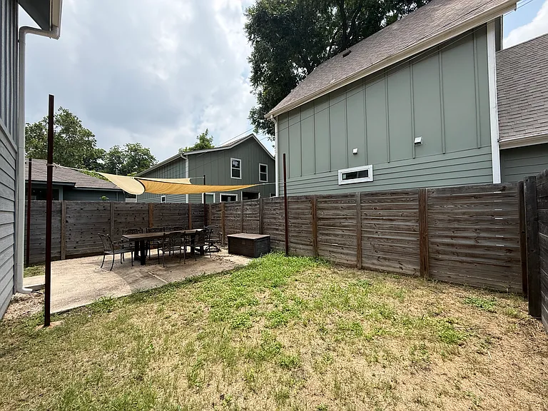 Side yard with covered patio