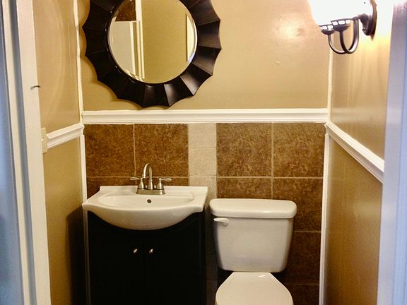 Nicely tiled bath with stand-up shower.
