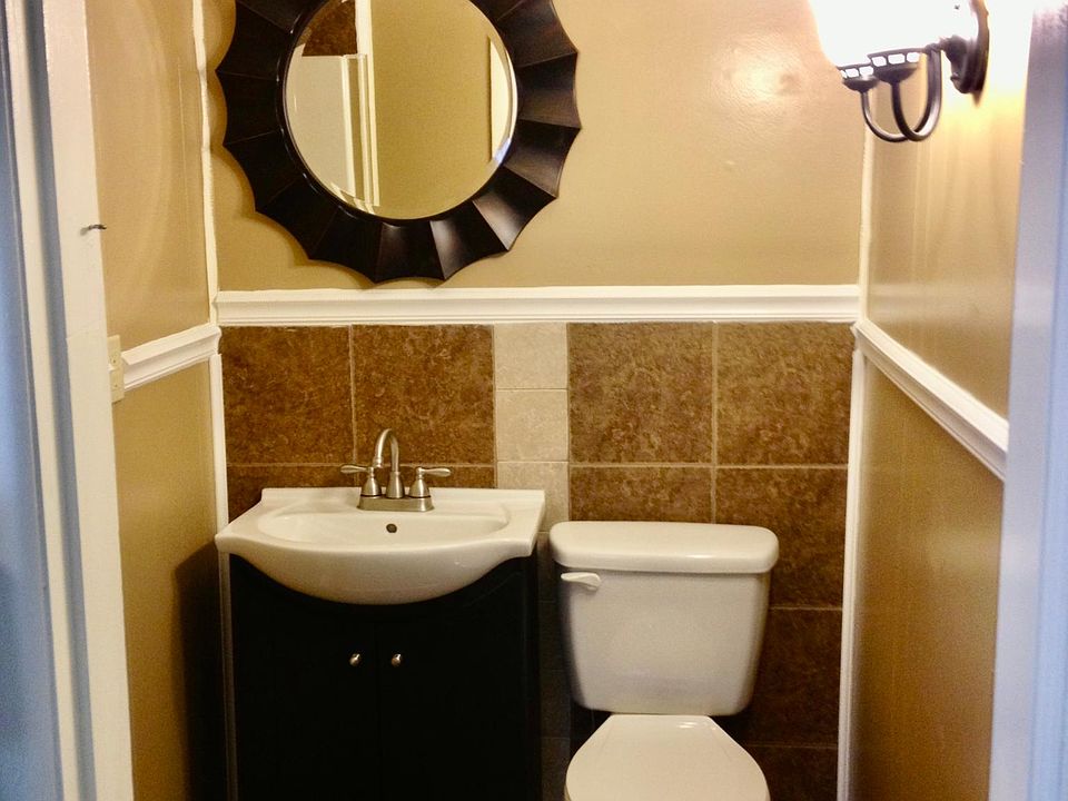 Nicely tiled bath with stand-up shower.