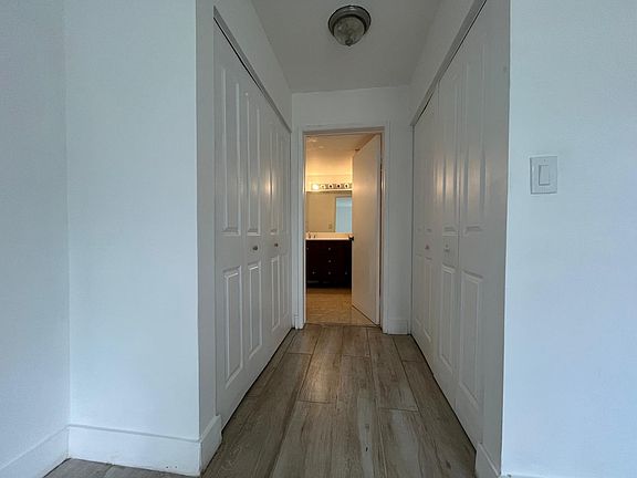 MAIN ROOM. VIEW OF 2 CLOSETS AND PRIVATE BATHROOM ENTRANCE