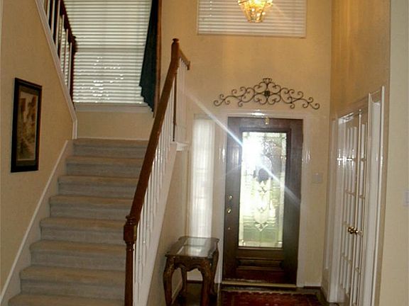 Lead glass door at entry. Glass storm door behind lead glass door.