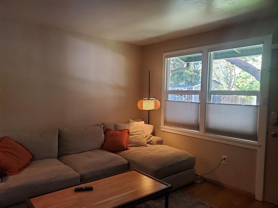 Living room with adjustable top down/bottom up shades..