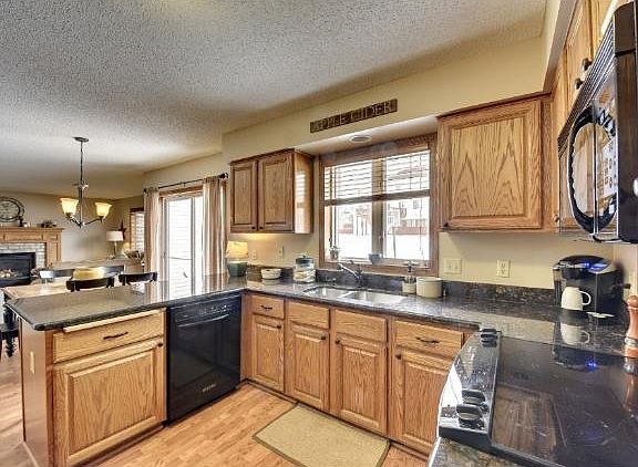 Open and spacious kitchen with granite counter-tops.