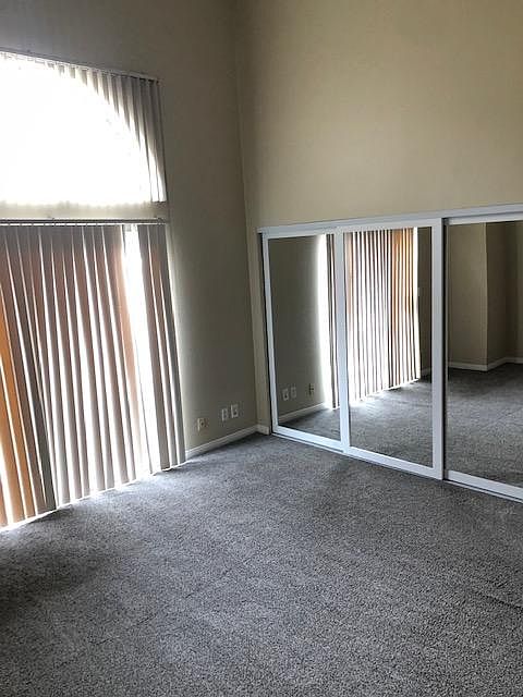 Master Bedroom with Vaulted Ceilings. New Mirror Wood Closet Doors