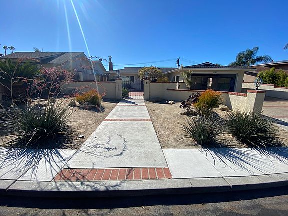 View from the sidewalk. Lovely Native Landscape in the Front Yard.