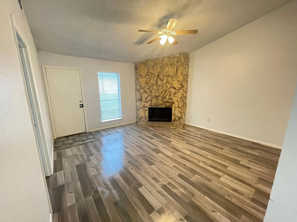 Stunning stone fireplace with raised ceilings
