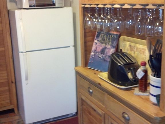 Cottage Kitchen with custom made cupboards made out of 200 y