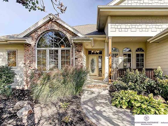 Professional landscaping with trees for front of home privacy.