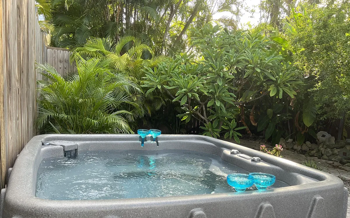 5 person hot tub in the tropical backyard. - 616 White St