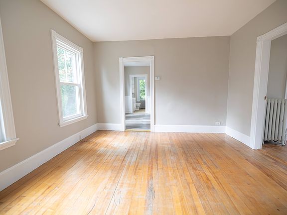 Living room at the front of the house, facing back towards bathroom