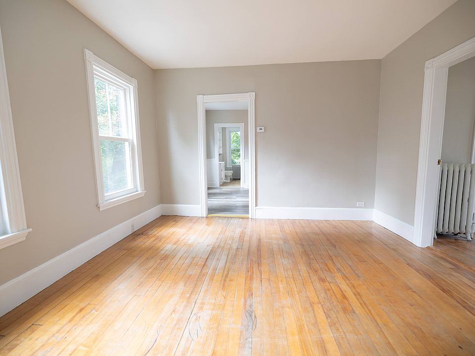 Living room at the front of the house, facing back towards bathroom