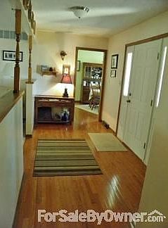 Foyer/Entry Leads out to Front Courtyard
						:
						Gleaming oak hardwoods in the foyer, hall, dining room and kitchen.