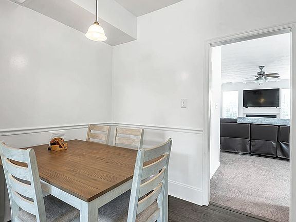 Dining area leading right into living room.