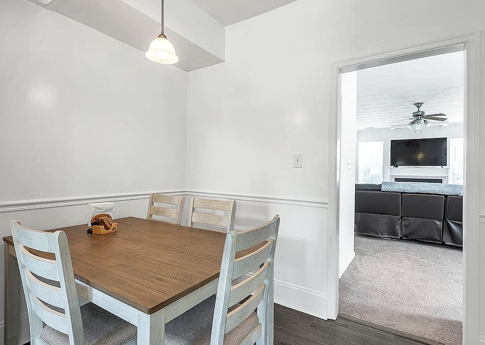 Dining area leading right into living room.