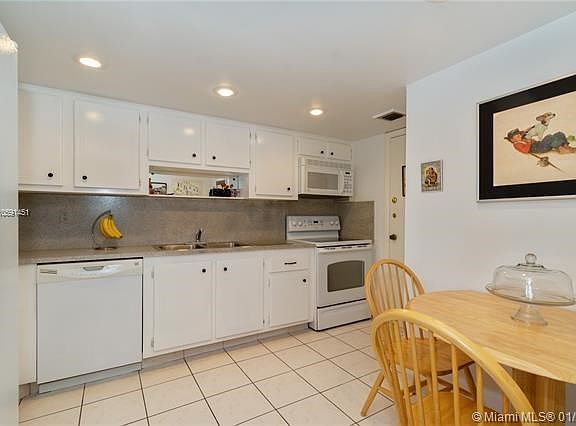 Spacious clean kitchen with breakfast nook and pass thru window to the dining room.
