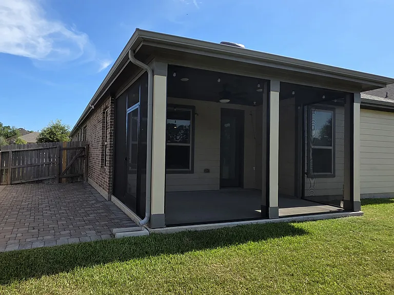 Screened patio and paved outdoor space